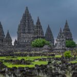 Stunning view of the ancient Prambanan Temple complex with dramatic sky in Java, Indonesia.