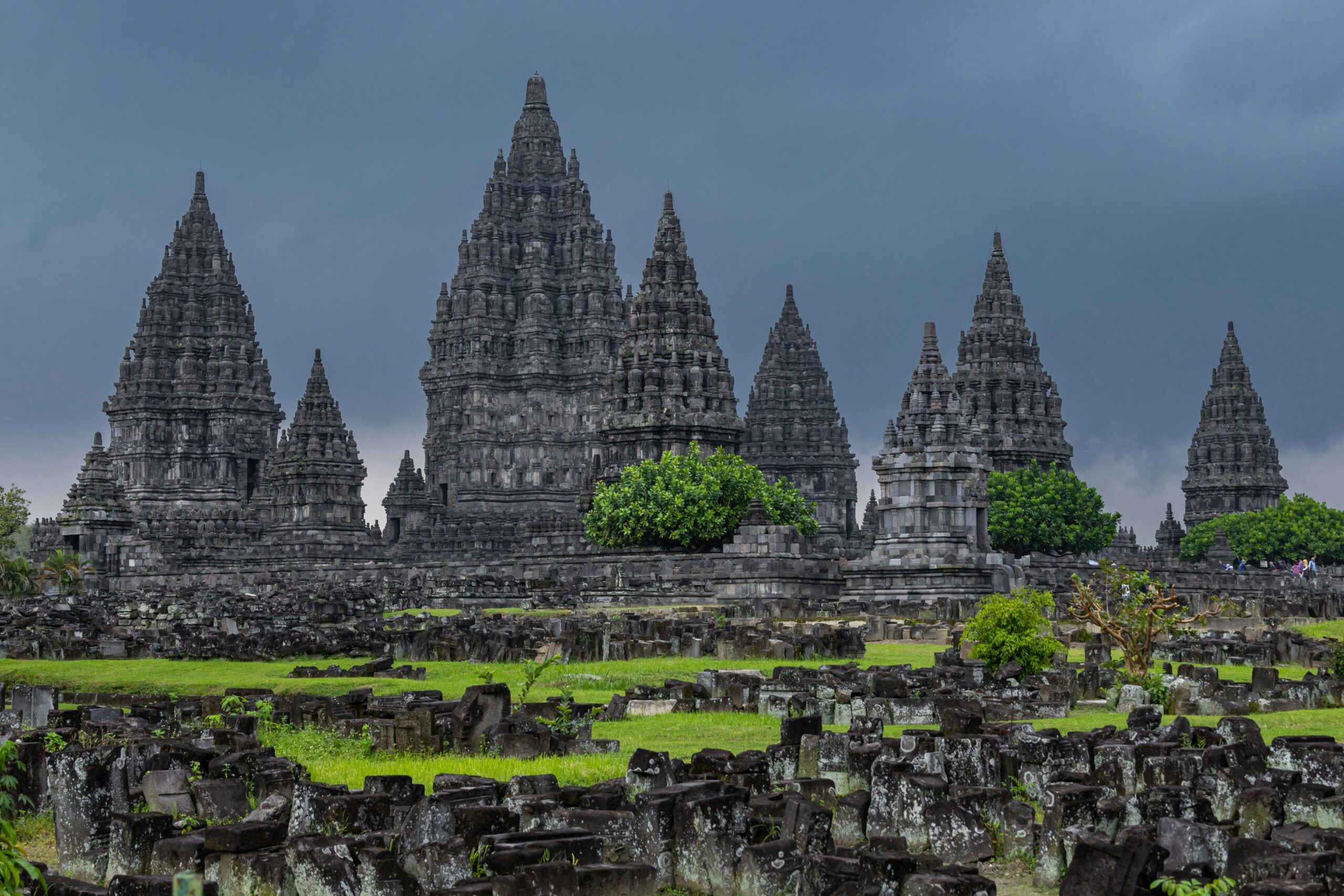 Stunning view of the ancient Prambanan Temple complex with dramatic sky in Java, Indonesia.